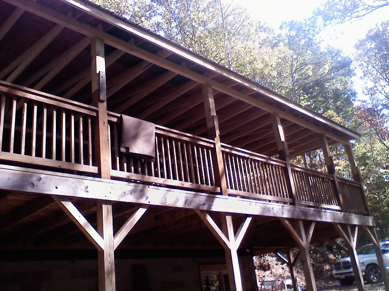Timber framing under a new elevated porch and deck — Roof Leak Repair in South Yarmouth by Roofing Brothers